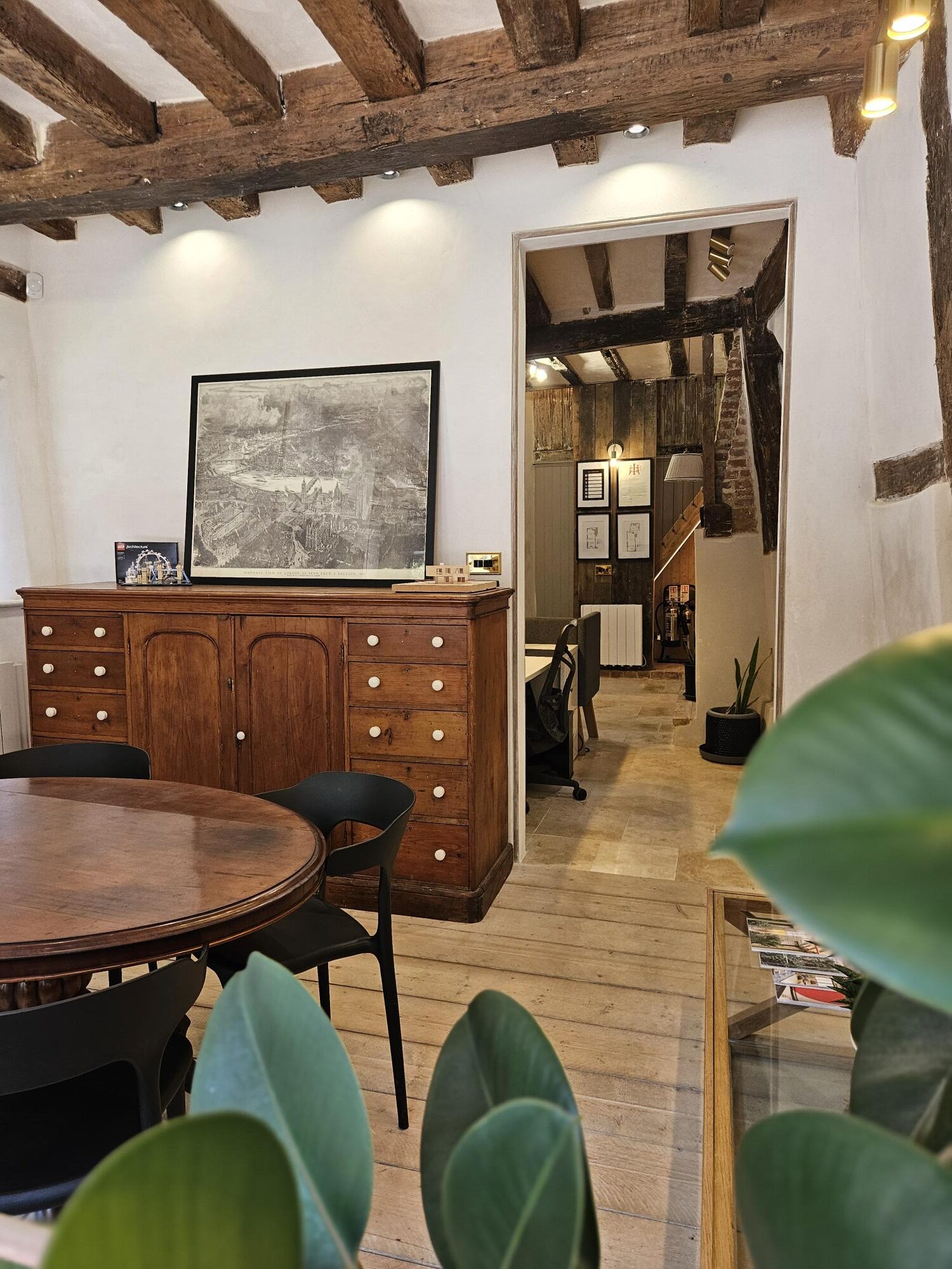 Restoring a historical building. Beautiful office entrance with restored historical beams, timber and modern touches